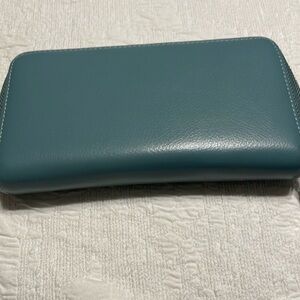8 1/2 X 5” leather zip wallet 36 slots for cc’s.